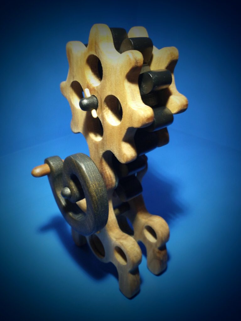 Close-up of wooden interlocking gears against a blue background.