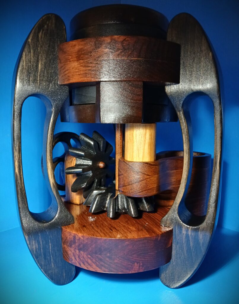 Intricately carved wooden puzzle with interlocking pieces and handles.