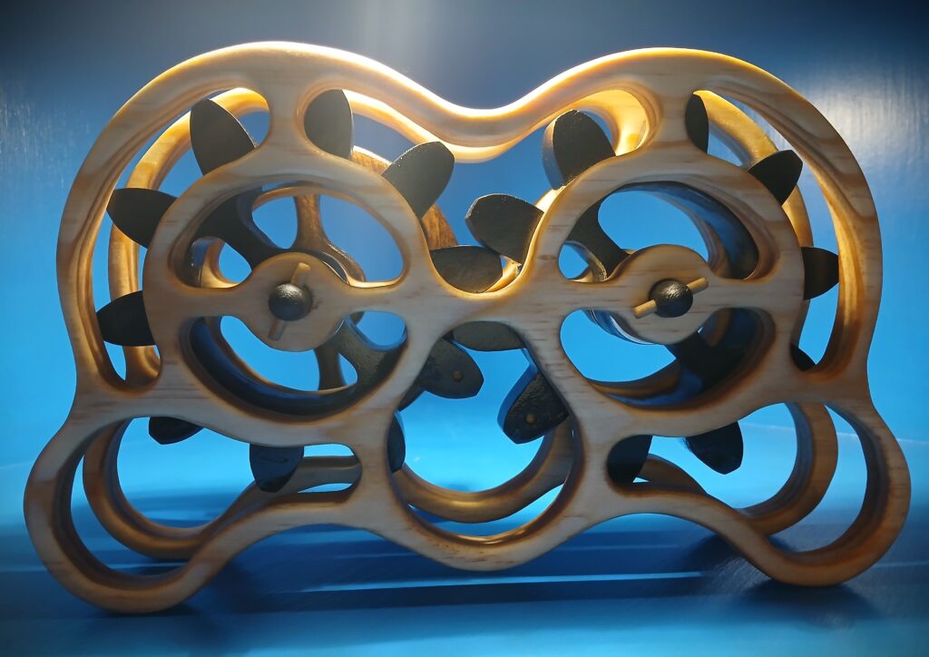 Intricately carved wooden puzzle with interlocking gears on a blue background.