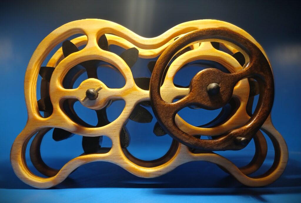Close-up of a wooden mechanical gear system with interlocking wheels.
